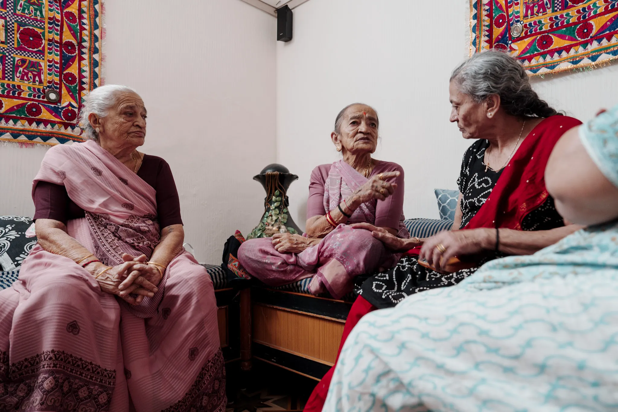 Women sitting together in a family sitting room.